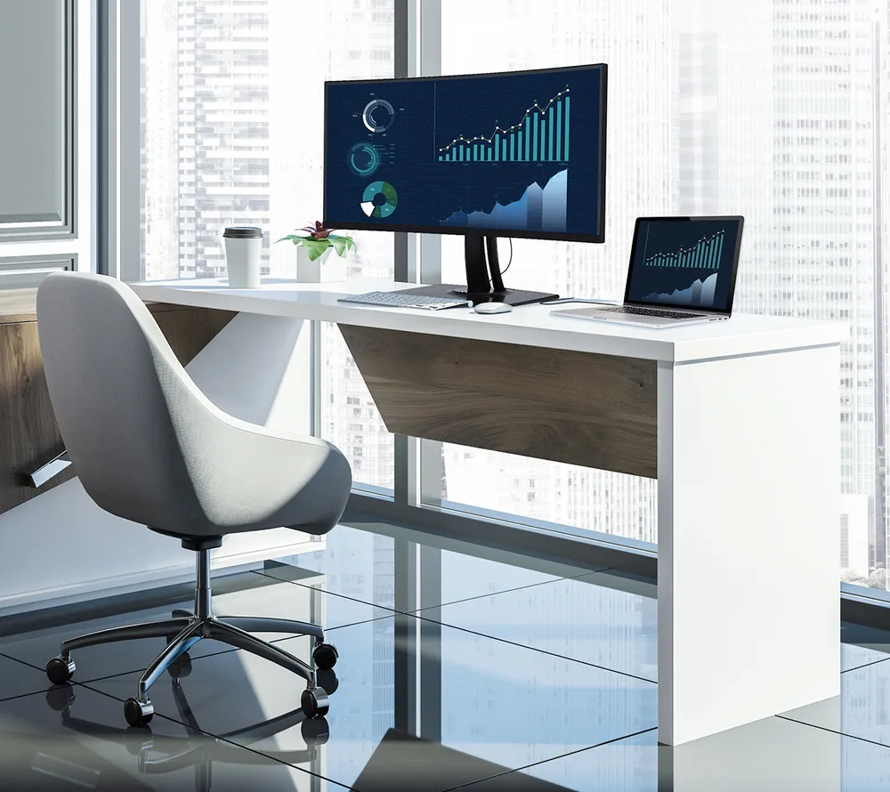 a clean office setup in front of a large window