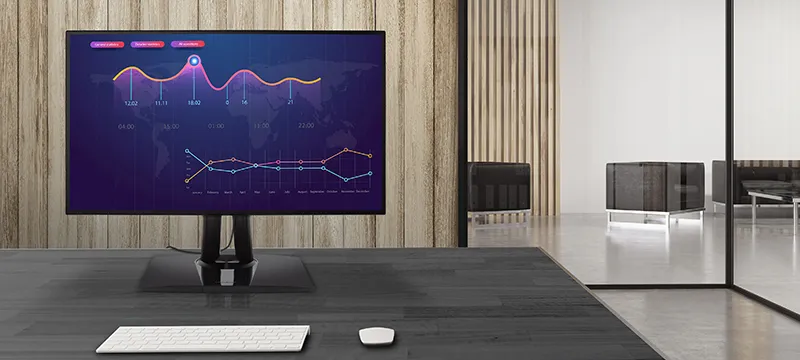 a monitor with a graph in an office