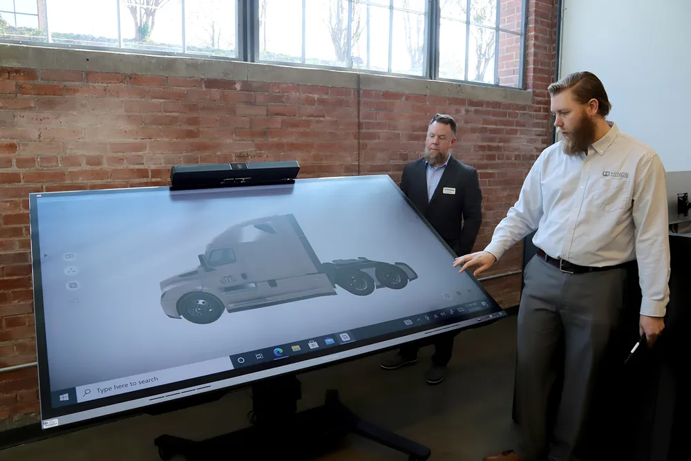 a viewboard in tabletop mode displays a cg render of a truck in a classroom