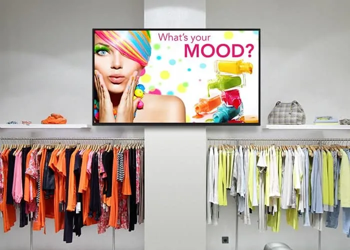 a display with a colorful image in the clothing section of a department store