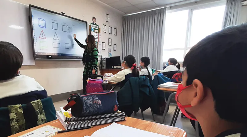 teacher using a viewboard to teach students geometry