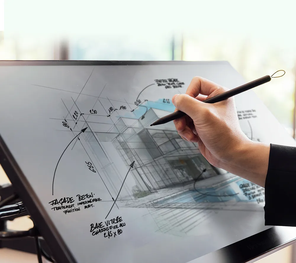 man using ID2456 to annotate on an architectural design