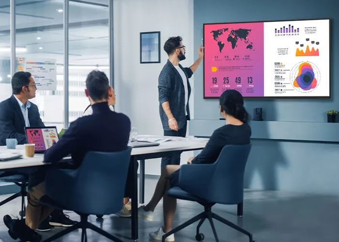 meeting room with man presenting on a ViewBoard